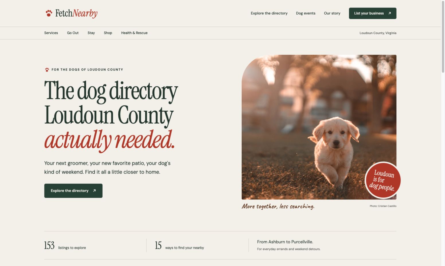 Screenshot of the FetchNearby homepage with a puppy running across grass and a headline about the Loudoun County dog directory.